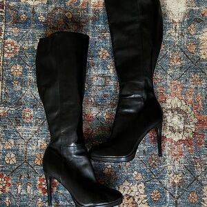 black leather heeled boots